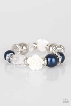 A collection of silver, pearly blue, and white crystal-like beads are threaded along a stretchy band around the wrist. A shiny white resin rose joins the refined palette for a glamorous finish.

 Sold as one individual bracelet. Luxury Oyster Beaded Bracelets For Formal Occasions, Cheap Hand-strung Blue Bracelets, Luxury Blue Bracelet With Spacer Beads, Cheap Party Beaded Jubilee Bracelets, Cheap Blue Beaded Bracelets As Fashion Accessory, Luxury Adjustable Jubilee Beaded Bracelets, Luxury Blue Oyster Bracelet Jewelry, Cheap Party Jubilee Beaded Bracelets, Cheap Blue Polished Beads Bracelets