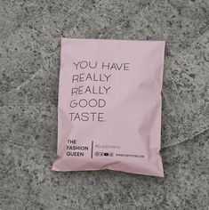 a pink bag with the words you have really really good taste on it sitting on concrete