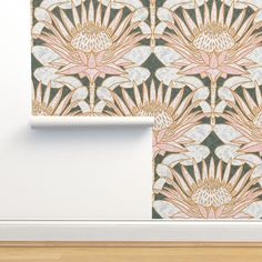 the wall paper is designed with an art deco flower design in gold and green colors