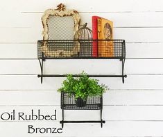 two metal shelves with plants and books on them, one shelf has a potted plant in it