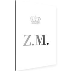 the z m logo is shown in black and white, with a crown on top