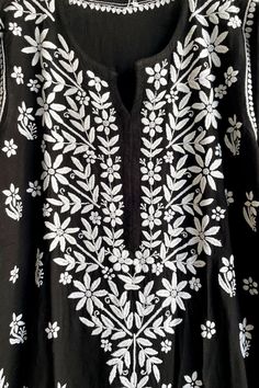 This Women's Black Rayon Cotton Kurta Lucknowi Hand Embroidered Dress is a unique and beautiful piece. The soft rayon cotton fabric offers a comfortable and relaxed silhouette to the wearer. The kurta is adorned with all over Lucknowi chikankari embroidery thread handwork. The back and sleeves of the kurti are decorated with loosely scattered motifs. 46" length Long sleeves 18" Round neck Rayon cotton Side slits Chikankari embroidery Hand embroidered Hand wash, dry flat Fit: True to sizeInside M Black And White Chikankari Kurta, Phulkari Pants, Lily Singh, Lucknowi Kurta, Hand Embroidered Dress, Gharara Suits, Patiala Salwar Suits, Chikankari Embroidery, Bridal Dupatta