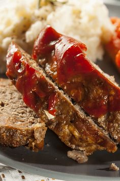 meatloaf with ketchup and mashed potatoes on a plate