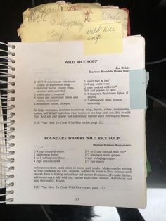 an old recipe book is open to show the instructions for making wild rice salads