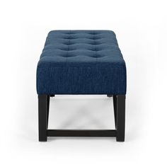 the foot stool is made from dark wood and blue fabric