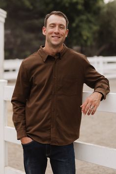 Get ready to elevate your man's style with our Mens John Shirt in Brown! Made with premium brown woven fabric, this mens shirt features a v-shaped collar neckline and long fitted sleeves with button cuffs. The button up style and breast pocket add a touch of versatility and convenience. Stand out from the crowd with this unique and stylish shirt - perfect for occasion and everyday wear. Mens Brown Shirt, Button Up Style, Shirt Outfit Men, Family Photoshoot Outfits, Girls Holiday Dresses, Brown Shirt, White Dress Party, Mens Button Up, Photoshoot Outfits