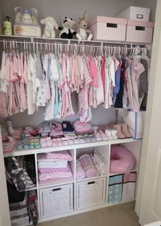 a closet filled with lots of baby clothes