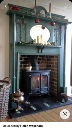 an old fashioned fireplace with a mirror above it