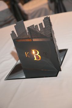 a table that has some kind of business card holder on it with the letter b