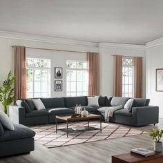 a living room filled with furniture and windows