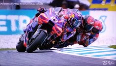 a person riding a motorcycle on a race track