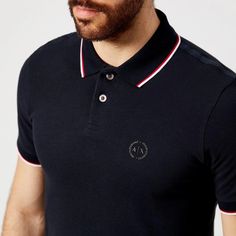 Men’s navy polo shirt from Armani Exchange. Crafted from woven piqué cotton, the polo shirt is detailed with contrast twin tipping on the ribbed polo collar and cuffs, a tonal ‘AX’ logo print on the left chest and a two-button placket. Complete with short sleeves, logo-engraved buttons and a straight hem with side slits..Main Fabric: 100% Cotton. Rib Details: 98% Cotton, 2% Elastane. Model is 188cm/6'2' and wears a size M. Navy Polo Shirt With Contrast Collar, Short Sleeve, Navy Polo Shirt With Contrast Collar, Navy Cotton Polo Shirt With Striped Collar, Navy Polo Shirt With Contrast Trim, Classic Navy Polo Shirt With Contrast Collar, Classic Navy Polo Shirt With Contrast Trim, Navy Cotton Polo Shirt With Contrast Collar, Ax Logo, Men Tips