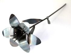 a metal flower on a white background