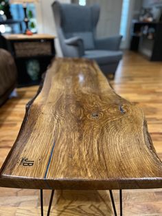 a wooden table sitting on top of a hard wood floor