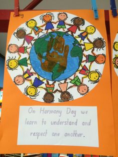 an orange sign with children's handprints on it that says, oh harmony day we learn to understand and respect one another