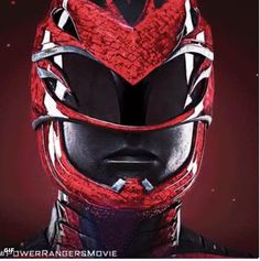 a close up of a person wearing a red and black mask with the words power rangers movie written on it