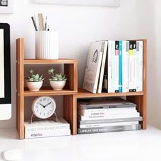 a computer monitor sitting on top of a desk