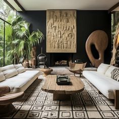 a living room filled with lots of furniture next to tall windows and plants on the wall