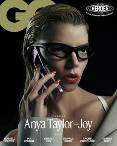 the cover of gq magazine features a woman in glasses talking on a cell phone