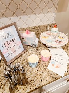 a kitchen counter topped with plates and cups next to a sign that says we clean station