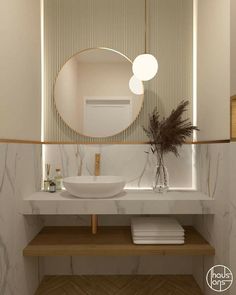 a bathroom sink with a mirror above it and a plant in the corner next to it