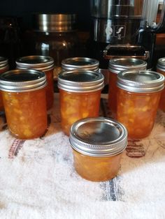 several jars filled with food sitting on top of a table