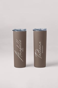 two brown tumblers sitting next to each other