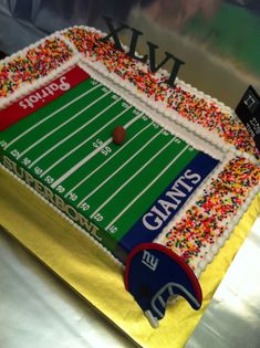 a cake shaped like a football field with sprinkles on the top and bottom