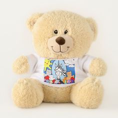 a teddy bear wearing a t - shirt with cartoon characters on it