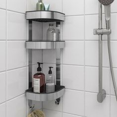 there is a shower head, soap and lotion on the shelf