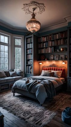 a bedroom with a bed, couch and bookshelf