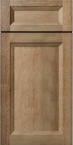 a close up view of an unfinished kitchen cabinet door with wood grain patterning on the doors