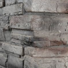 an old brick wall is shown in close up with only the bricks visible on it