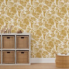 the wallpaper in this room is yellow and has many baskets on top of it