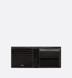 The vertical bifold wallet is a compact accessory with sophisticated appeal. Crafted in black grained calfskin, it is adorned with the CD Icon signature on the front. Its interior features a double bill compartment, two slip pockets for receipts, four card slots and a gusseted coin compartment with a snap closure. The bifold wallet will slip easily into any pocket or bag.. Designer Trifold Wallet With Coin Pocket For Business, Designer Trifold Wallet With Interior Card Slots For Business, Designer Trifold Wallet With Rfid Blocking For Business, Compact Leather Wallet For Formal Occasions, Compact Leather Wallets For Formal Occasions, Luxury Black Compact Trifold Wallet, Luxury Black Trifold Wallet For Business, Luxury Trifold Wallet With Coin Pocket For Business, Luxury Leather-lined Trifold Wallet For Formal Occasions