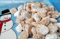 a pile of puppy chow with a snowman on the side and a blue background