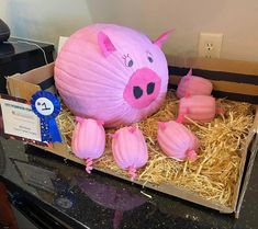 there is a pig in the box with three pigs on it and one pig has been cut out to look like they are eating