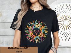 Step Back in Time with Our Retro Sun Design T-Shirt! Looking for a cute and stylish addition to your wardrobe? Our Retro Sun Design T-Shirt is the perfect choice! Featuring a charming vintage-inspired sun graphic, this tee is sure to bring a touch of nostalgia to your everyday look. Key Features: Retro Sun Design: Our tee showcases a delightful retro sun graphic that adds a playful and cheerful vibe to any outfit. Whether you're a fan of vintage style or just love a cute and quirky design, this Bohemian Black Shirt For Vacation, Black Bohemian Shirt For Vacation, Bohemian Style Black Shirt For Vacation, Black Custom Print Shirt For Beach, Black Shirt With Custom Print For Summer, Fun Black Summer Shirt, Black Printed Summer T-shirt, Cute Custom Print Shirt For Summer, Bohemian Custom Print T-shirt For Summer