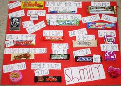 a bulletin board with candy bars on it and some words written in white paper to spell out what they are