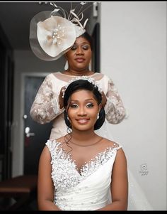 the bride is getting ready for her big day at the wedding ceremony with her mother