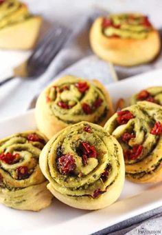 several small pastries on a white plate