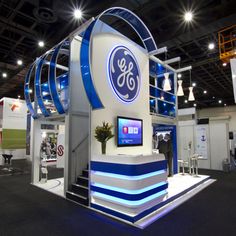 an exhibit booth with the company's logo on it