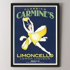 a framed poster with an image of a woman holding a glass in her hand and the words, bellie limocello lemon liqueur