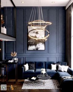 a living room filled with furniture and a chandelier hanging over the top of it