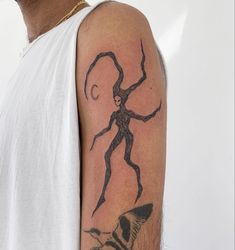 a man with a tattoo on his arm