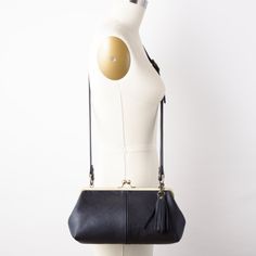 "This lovely retro style kiss lock crossbody bag is created with your choice of SIX top quality, semi-structured (not rigid) leather color options (black, navy, dark brown, red, burgundy or taupe) and your choice of antique brass finish or silver finish hardware with an adjustable crossbody strap. Also included is a matching hand cut leather tassel handbag charm. This crossbody handbag has a FULLY LINED black hopsack linen fabric interior with a interior zipper pocket and slip pocket. Would you Kiss Lock Purse, Frame Purse, Leather Frames, Handbag Charms, Red Burgundy, Petite Tops, Leather Tassel, Small Tops, Crossbody Strap