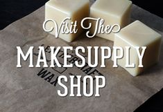 three cubes of soap sitting on top of a piece of wax paper that says visit the make supply shop