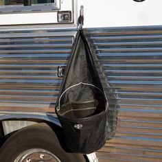 a black bag hanging from the side of a bus