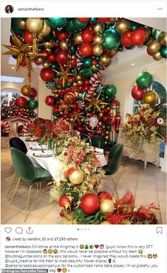 an image of a christmas party with balloons and decorations on the ceiling, along with tables and chairs