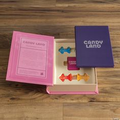 the candy land set is in its pink box and has two candies on it